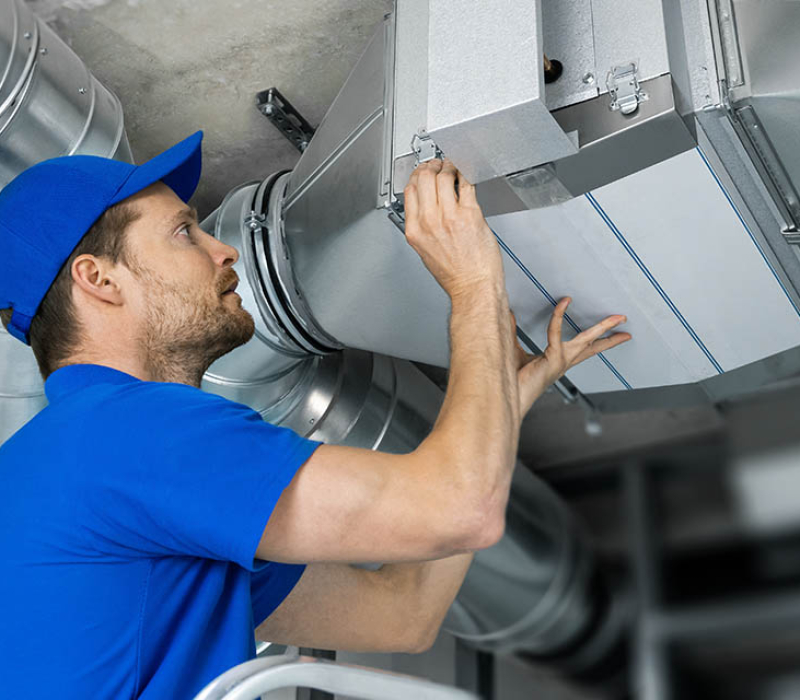 ventilation system installation and repair service. hvac technician at work. banner copy space